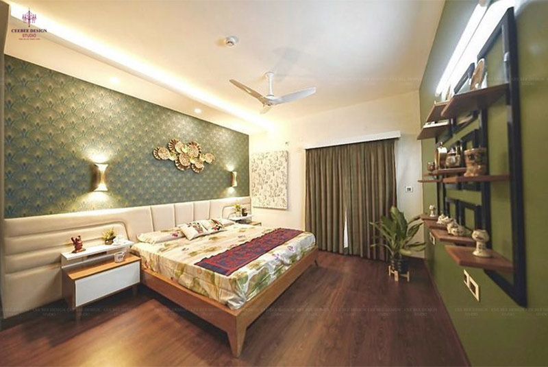 A bedroom with a green wall decor and wooden floor curtains