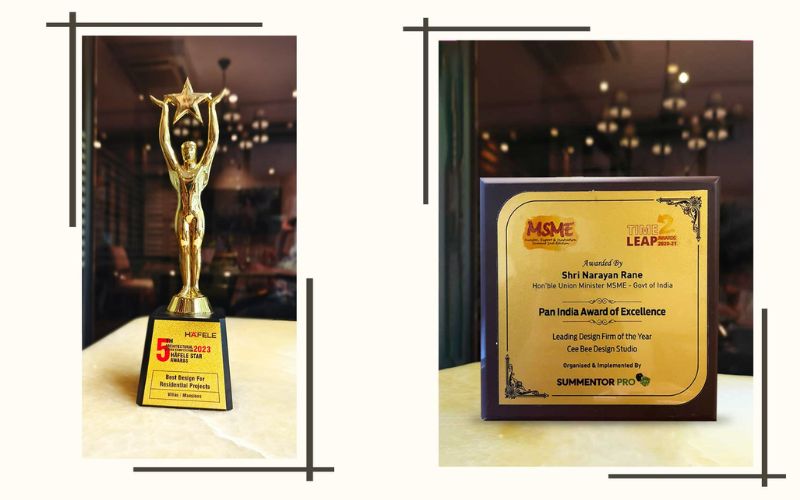 an award resting on a table, accompanied by a trophy