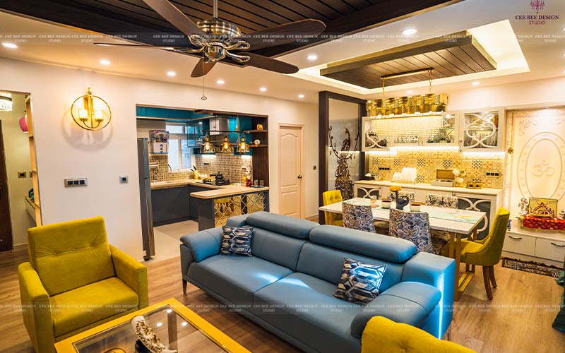 Interior of a living room featuring blue and yellow furniture, adding a cheerful touch to the decor.