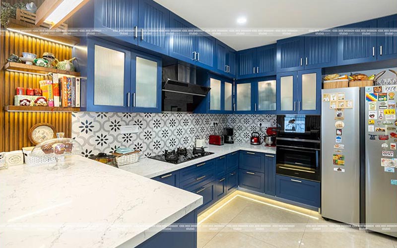 blue modular kitchen with proper storage systems