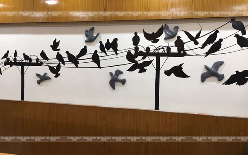 a wall with birds on it