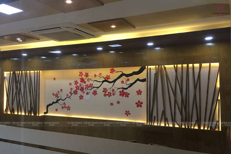 Commercial interior design featuring a modern office with a cherry blossom wall painting.