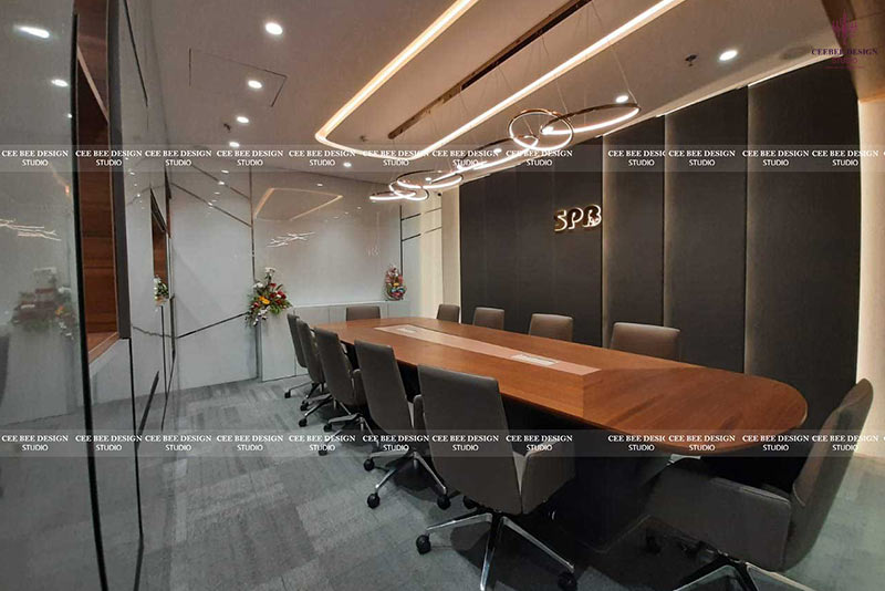 an office room with white ceiling lights and pattern walls with a table and chairs