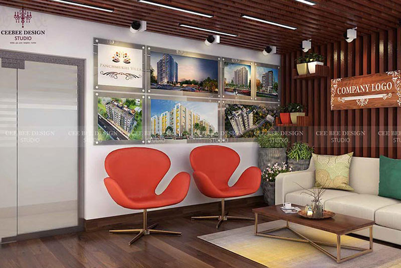 A professionally designed office space showcasing a modern lobby setup with a couch, coffee table, and chairs.