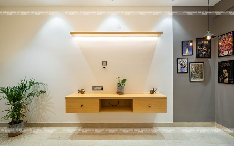 a contemporary bathroom featuring a wooden vanity and a touch of nature with a plant