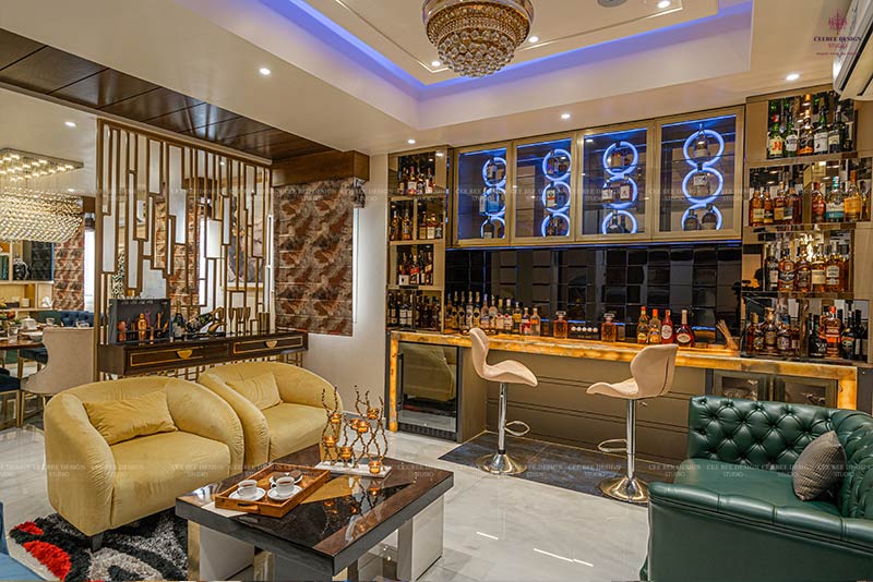 A modern home bar with a sleek design, complete with a bar area and comfortable couches.