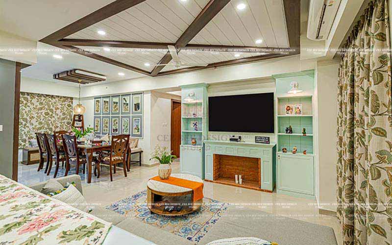 Modern living and dining room with a television.