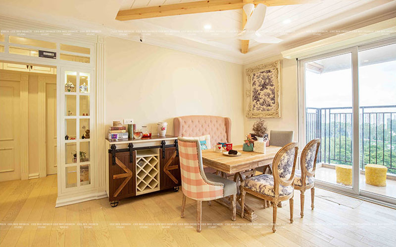 a tastefully decorated english dining room with a wooden table and comfortable chairs for a cozy meal