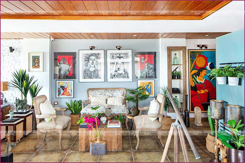 a vibrant living room adorned with numerous plants and captivating artwork