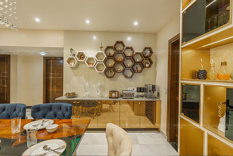 Stylish dining area in 3bhk luxury home with gold and white decor.