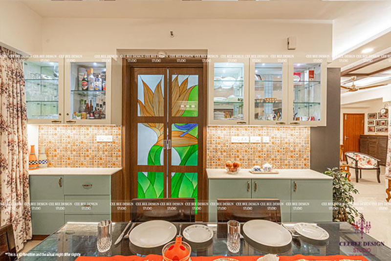 Modern kitchen featuring a glass door, creating a bright and airy atmosphere