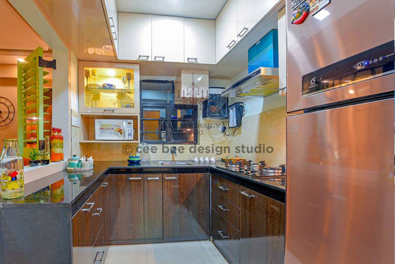 Well-equipped kitchen with refrigerator, sink, and counter top.