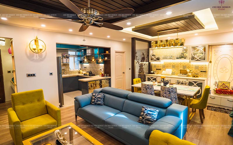 Elegant turnkey interior design: A living room featuring stylish blue and yellow furniture.