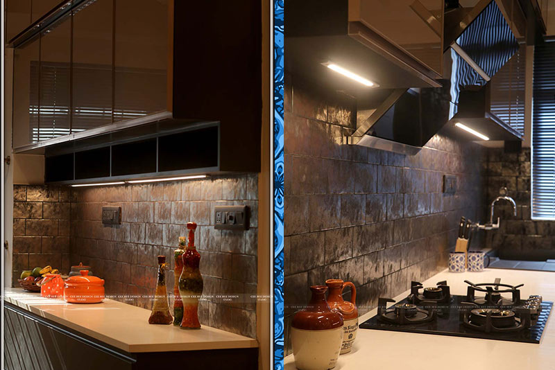 Interior of a modular kitchen with stove and sink.