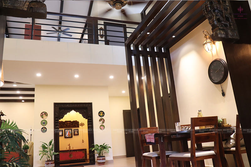 A dining room with a wooden ceiling fan and table.