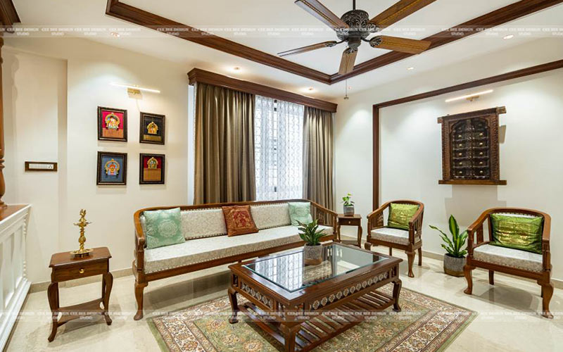 a cozy living room with wooden furniture and a ceiling fan, creating a warm and inviting atmosphere