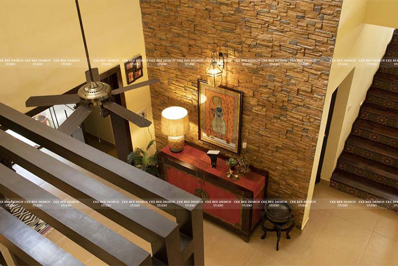 Aerial view of a home with a fan and a lamp, showcasing a cozy and well-lit living space.