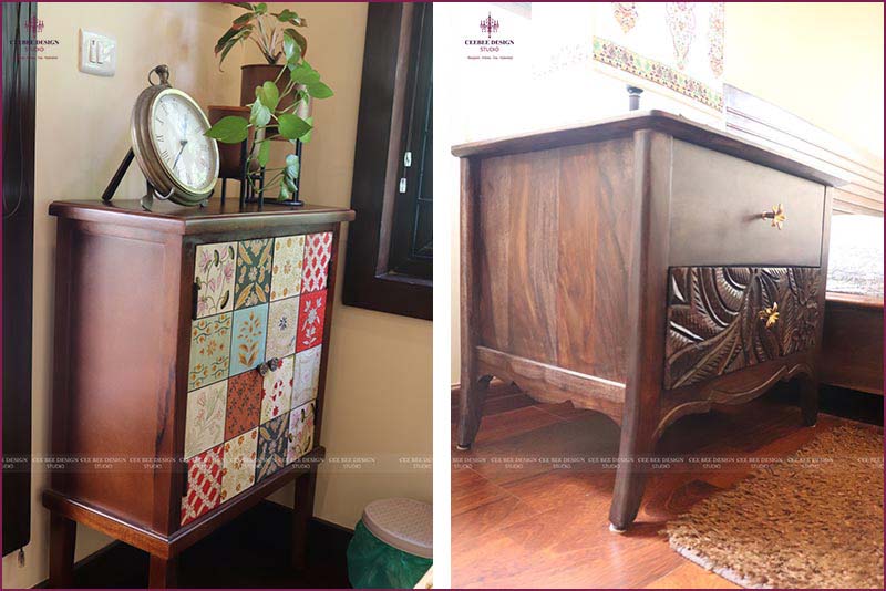 Vintage clock displayed on wooden cabinet.