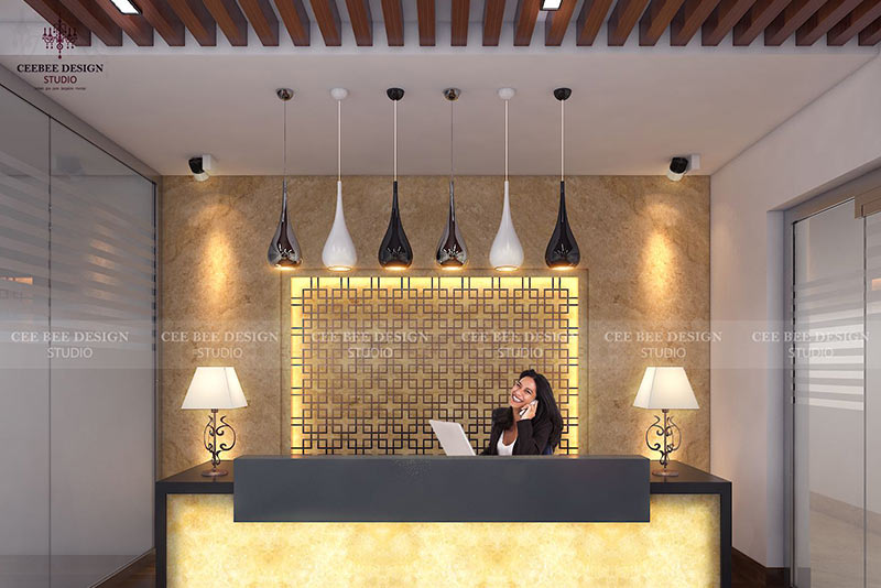 A woman stands at the reception desk in a modern office, showcasing sleek office interior design.