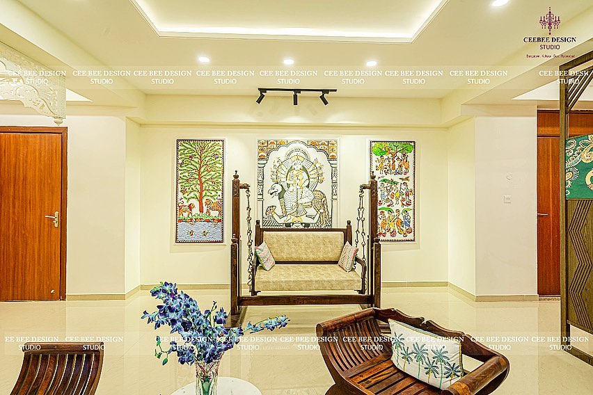 spacious living room with goddess wall poster swinging wooden seat