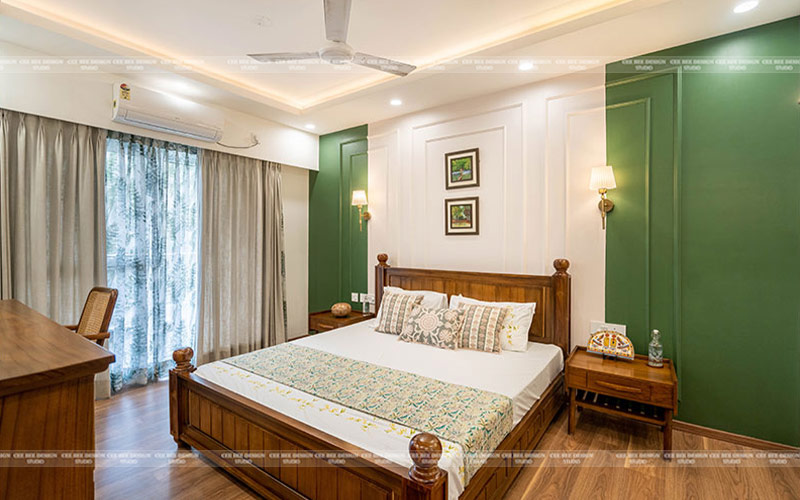 white in green bedroom interior design with bed and wooden furniture