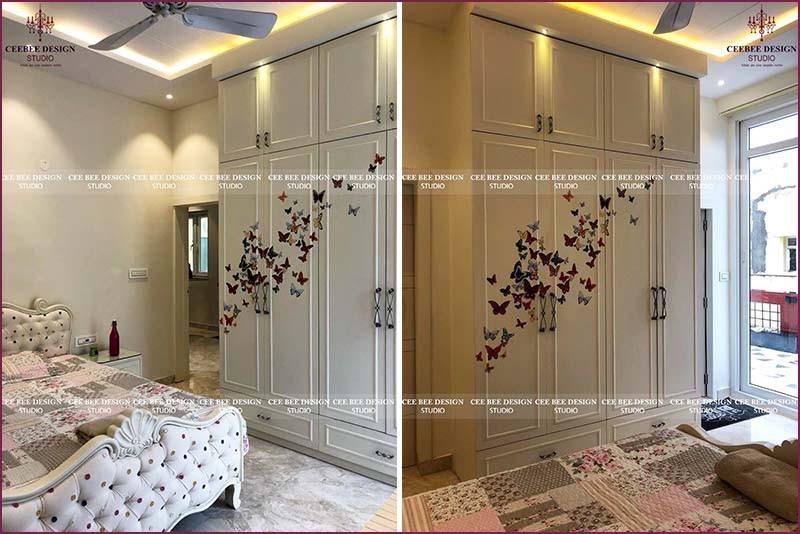 white wardrobe design with bed and stickers