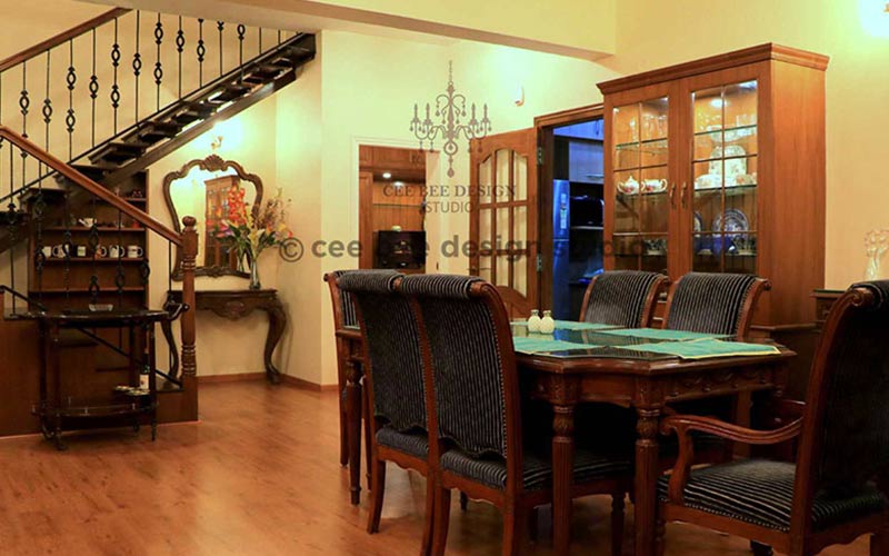 wooden interior design dining room with crockeries and stairs behind