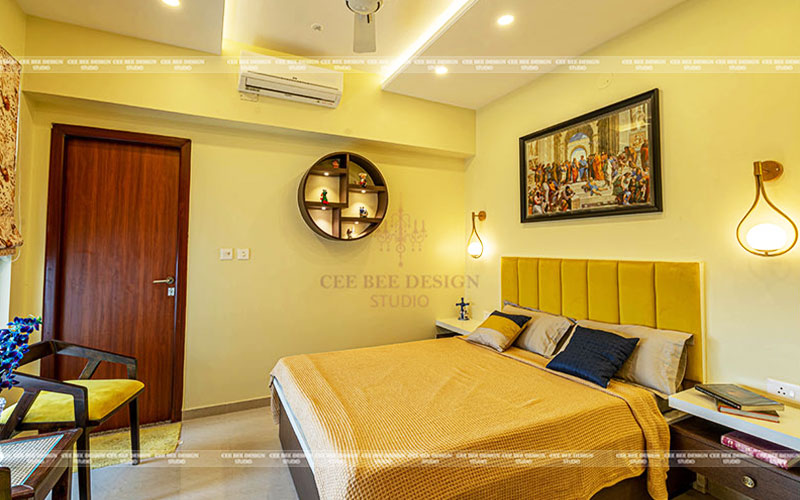 yellow bedroom with wall art and bed and ac in the above wall